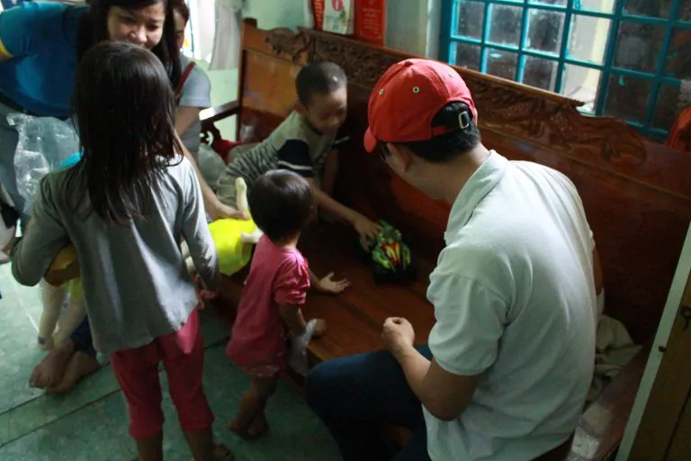 Children eating snacks receiving from PEB Steel