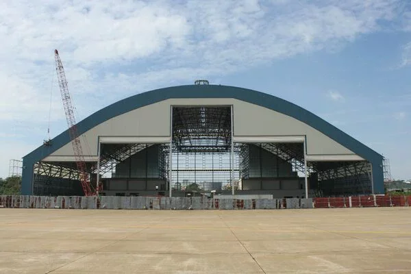 The hangar uses a prefabricated curved steel frame at Tan Son Nhat airport
