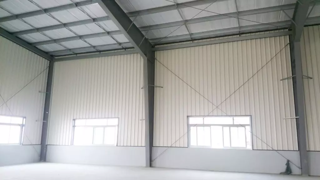Prefabricated steel frame house using PebLiner™ corrugated iron roof of Pebsteel