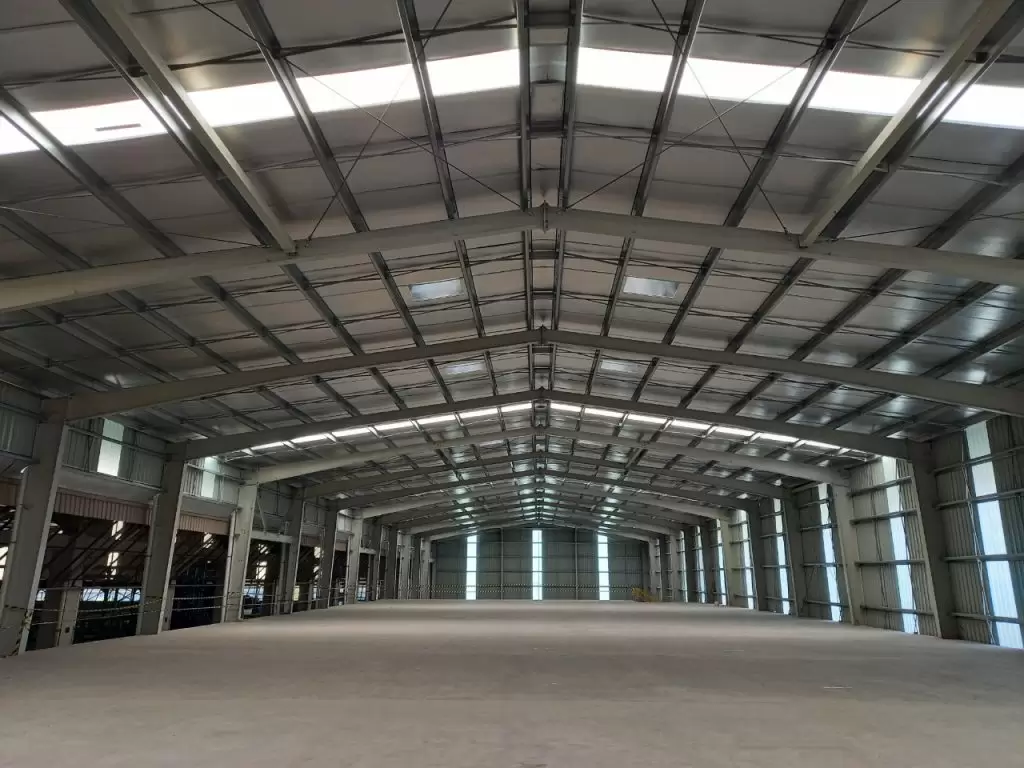 A steel shed uses a steel frame as its primary structural support.