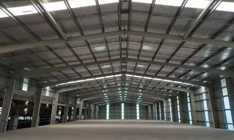 A steel shed uses a steel frame as its primary structural support.