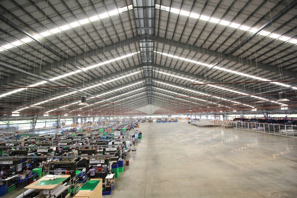 Portal rigid steel frame used in modern steel structure buildings, providing a wide clear-span space for industrial operations.